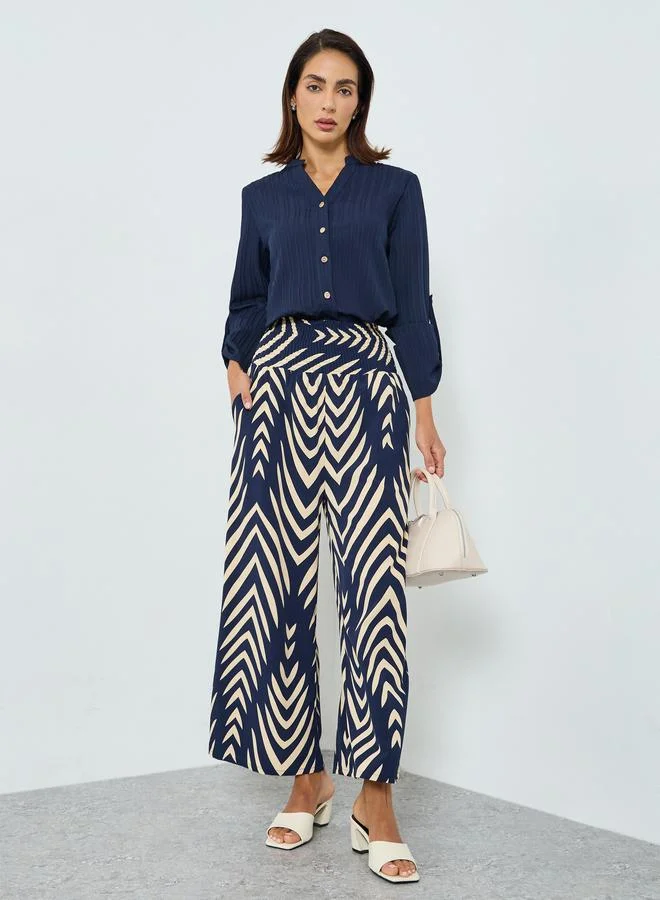 تايك تو بنطال بأرجل واسعة وخصر عالي مرن ومقلم